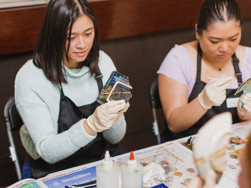 Two friends enjoying a kintsugi class for a birthday