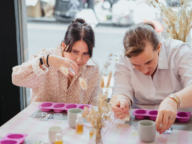 Two women enjoying a skincare making workshop together