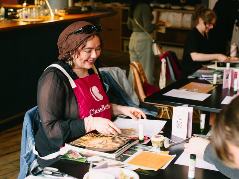 A woman manifesting her year at a vision board class