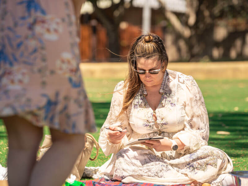 A woman paints at an art class