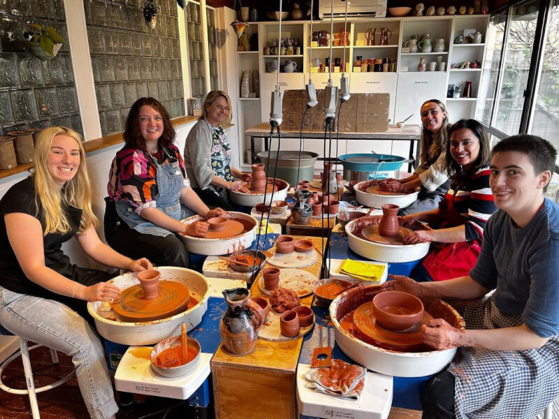 Group of people at a wheel throwing class in Perth