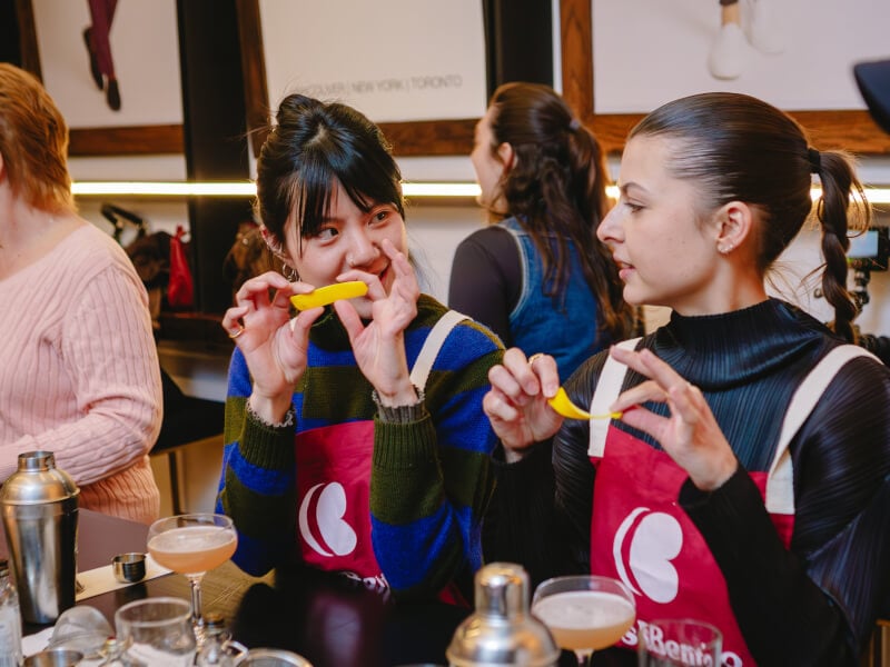Two women enjoying their cocktails at a cocktail class