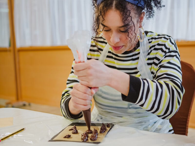 Woman making chocolate as a hens party activity
