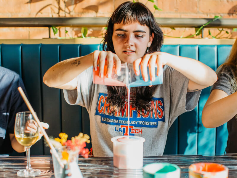 A woman enjoying the fluid art class she was gifted for Valentine's Day