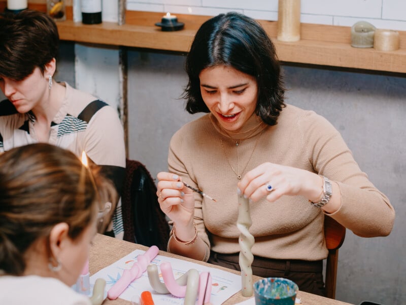 Woman enjoys a candle making class as her Mother's Day gift