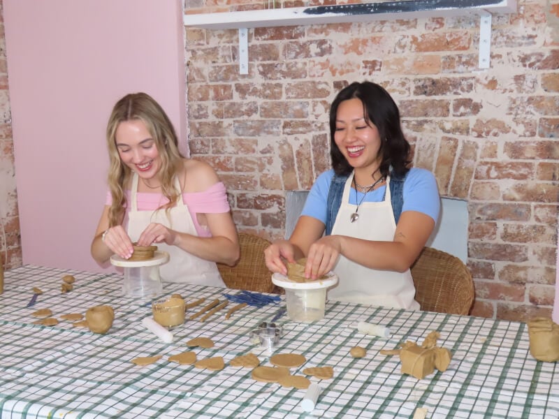 Two women making pottery