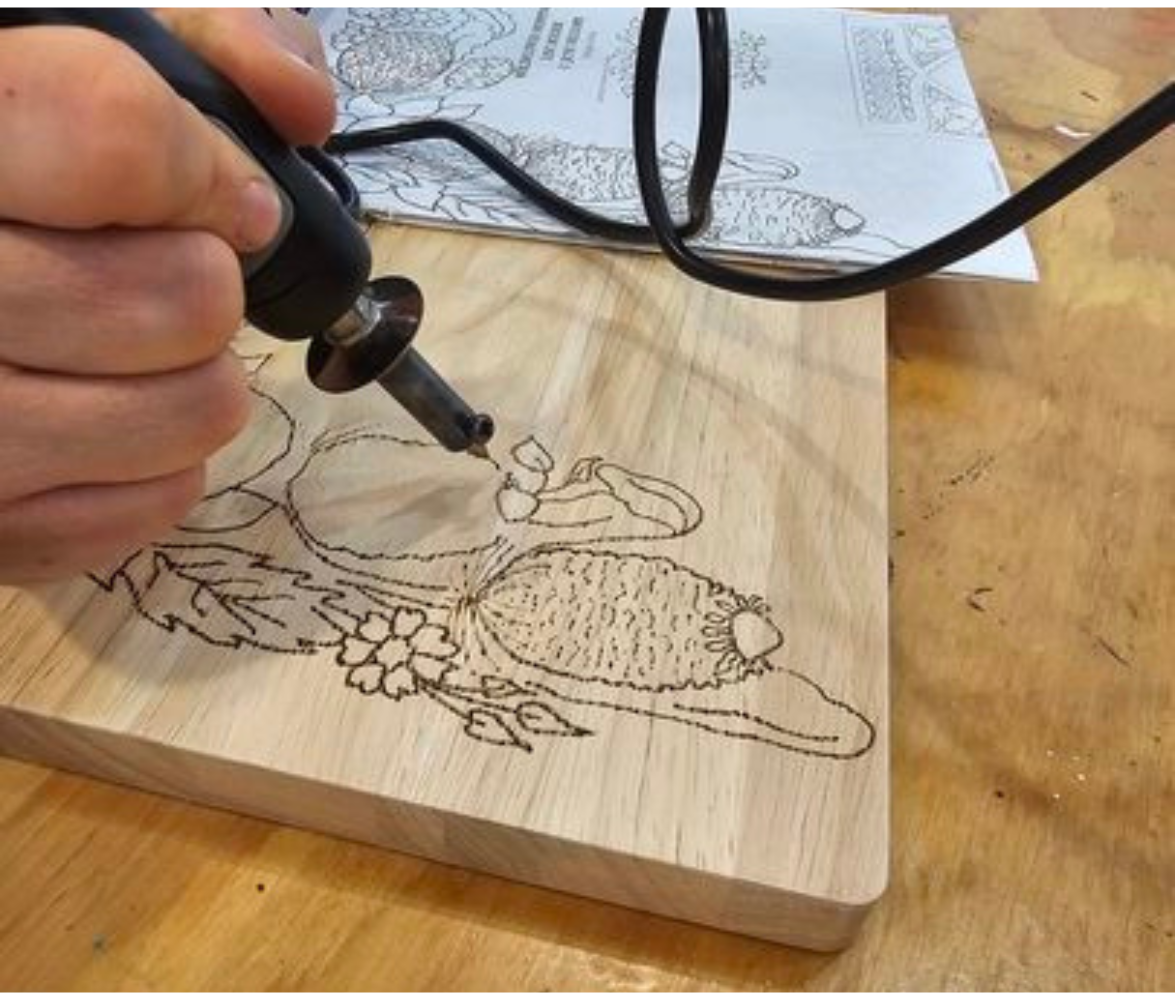Person doing wood burning