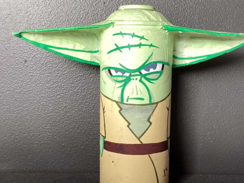 A spray can decorated to look like yoda